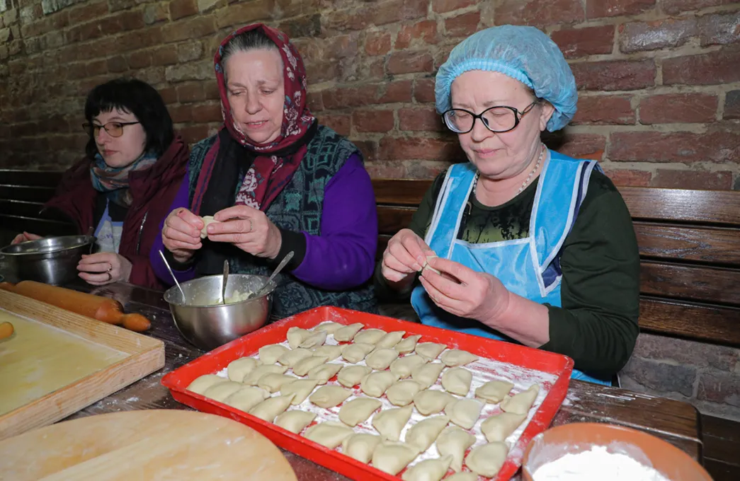 Volunteers make varenyky for Ukrainian service members and refugees. Female volunteers have grouped together provide support for refugees and Ukrainian troops, Lviv, Ukraine, the 17th March of 2022. 