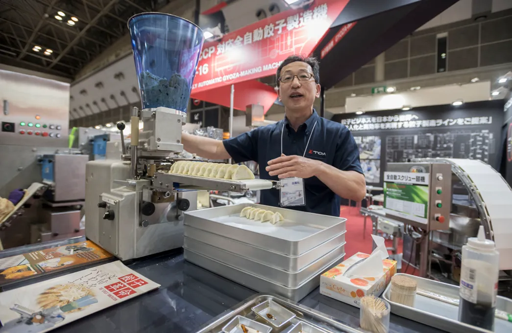 Fully-automated gyoza-making machine on display at the International Food Machinery & Technology Exhibition ''FOOMA JAPAN'' 2018 in Tokyo Big Sight on June 15, 2018, Tokyo, Japan. 