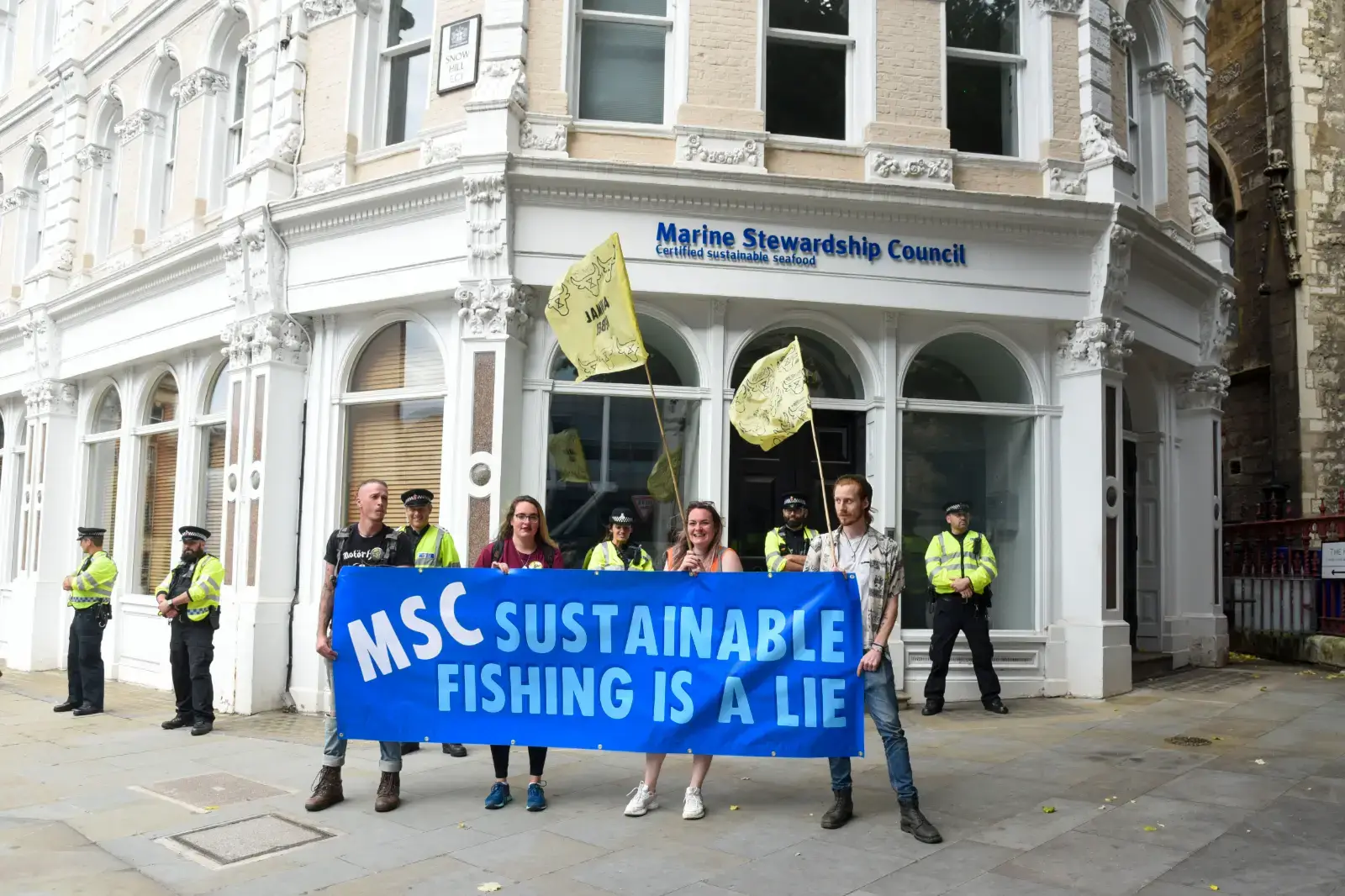 Protesters and police seen outside the offices of Marine Stewardship Council, during Extinction Rebellion's Animal Rebellion demonstration, London August 2021 