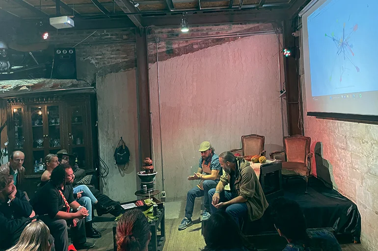 Sergio Figueredo, the Founder of Choco4Peace and Will Ruddick, the Founder of Grassroot Economics, discuss the Decentralised Inclusive Economic Network for cacao farmers at Casa Palma Hub, Colombia. (Photo by the author)