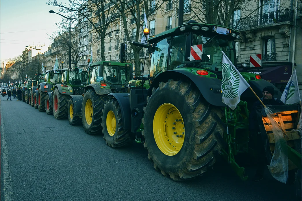 Farmers gather with their tractors during a demonstration