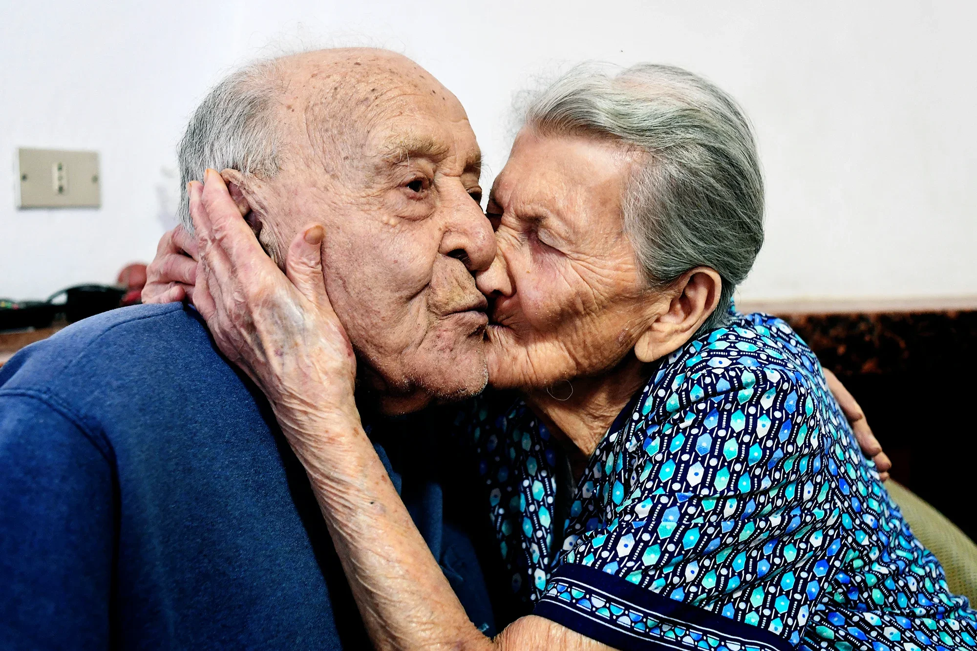 Antonio Vassallo, 100 years-old, and his wife Amina Fedollo, 93, pose in their house in Acciaroli, southern Italy.